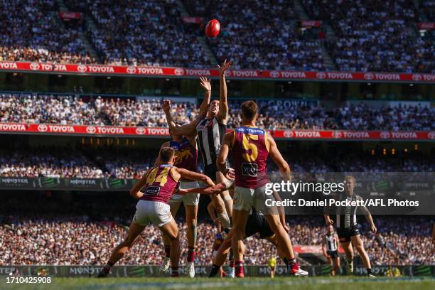 Darcy Cameron of the Magpies and Oscar McInerney of the Lions contest the ruck during the 2023 AFL Grand Final match between Collingwood Magpies and...