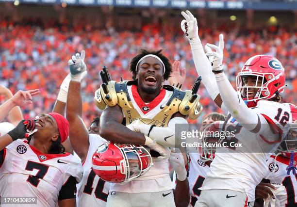 Malaki Starks of the Georgia Bulldogs celebrates with teammates after an interception against the Auburn Tigers during the fourth quarter at...