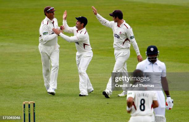 Marcus Trescothick of Somerset and team mates celebrate after catching out Derbyshire batsman Chesney Hughes during day one of the LV County...