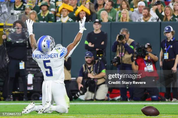 David Montgomery of the Detroit Lions celebrates a touchdown during a game against the Green Bay Packers at Lambeau Field on September 28, 2023 in...