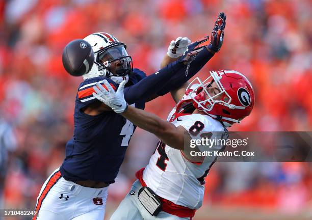 Ladd McConkey of the Georgia Bulldogs fails to pull in this reception against D.J. James of the Auburn Tigers during the third quarter at Jordan-Hare...