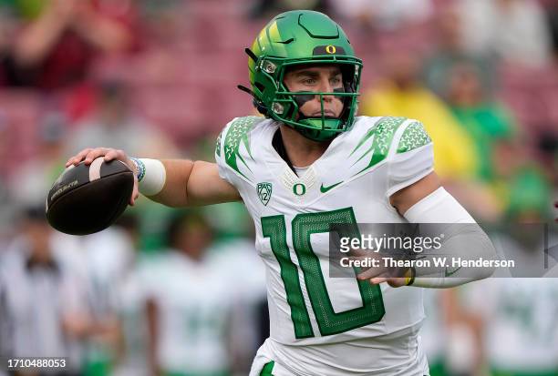 Bo Nix of the Oregon Ducks throws a pass against the Stanford Cardinal during the second quarter of an NCAA football game at Stanford Stadium on...