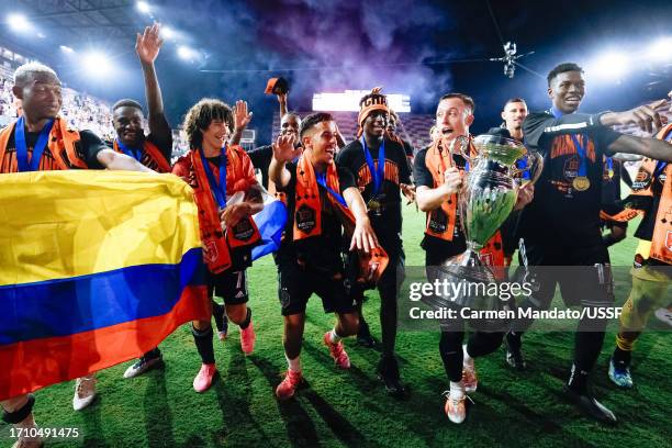 The Houston Dynamo celebrate after defeating Inter Miami 2-1 in the 2023 Lamar Hunt U.S. Open Cup final at DRV PNK Stadium on September 27, 2023 in...