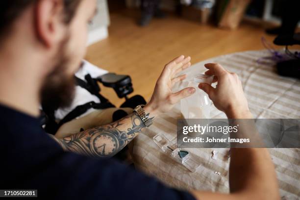 man preparing nutrition for feeding tube - feeding tube stock pictures, royalty-free photos & images