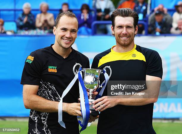 Bruno Soares of Brazil and Alexander Peya of Austria pose with the trophy after their victory in the men's doubles final against Colin Fleming and...