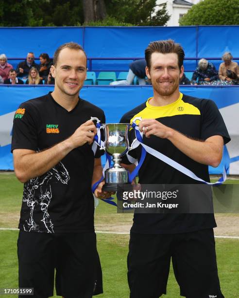 Bruno Soares of Brazil and Alexander Peya of Austria pose with the trophy after their victory in the men's doubles final against Colin Fleming and...