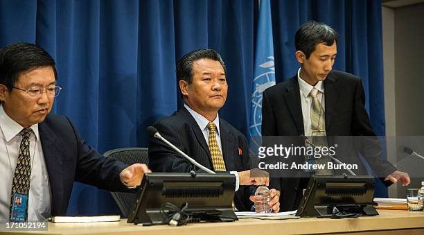 Sin Son-ho, center, North Korea's Permanent Representative to the United Nations, speaks at a press conference at the United Nations on June 21, 2013...