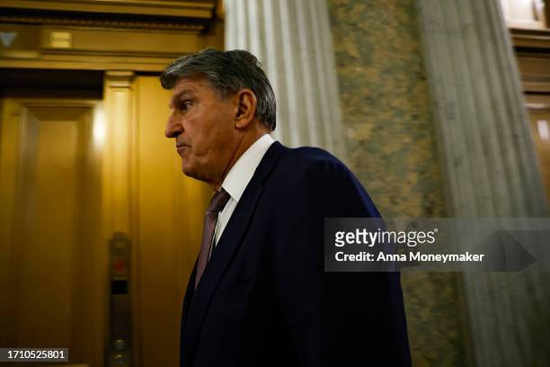 Sen. Joe Manchin walks to the Senate Chambers during a vote on a continuing resolution to fund the government on September 30, 2023 in Washington,...