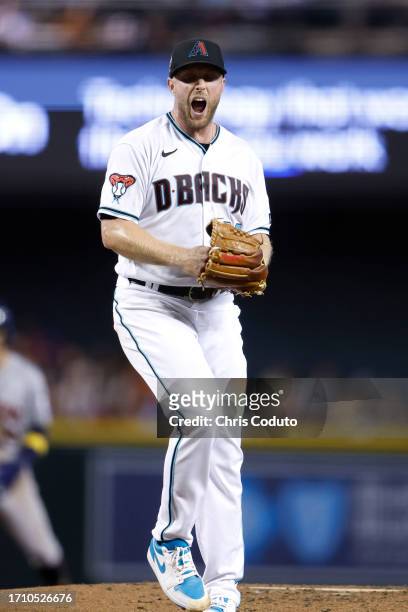 Starting pitcher Merrill Kelly of the Arizona Diamondbacks reacts after the final out during the third inning against the Houston Astros at Chase...