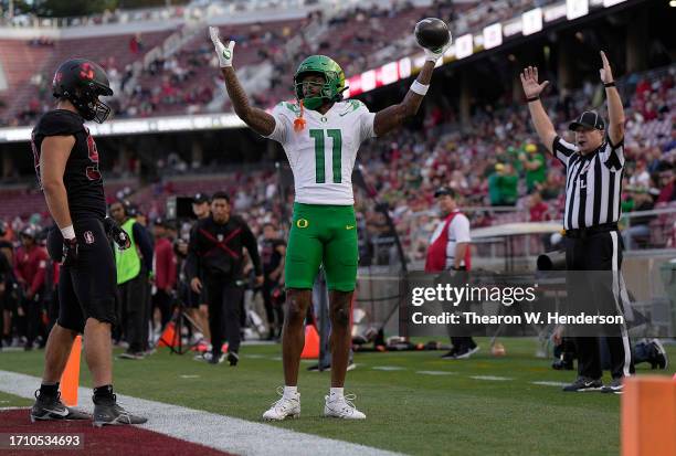 Troy Franklin of the Oregon Ducks celebrates after scoring on a five-yard pass play against the Stanford Cardinal in the third quarter at Stanford...