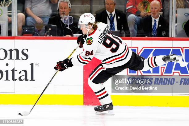 Paul Ludwinski of the Chicago Blackhawks passes the puck against the Minnesota Wild in the third period at Xcel Energy Center on September 30, 2023...