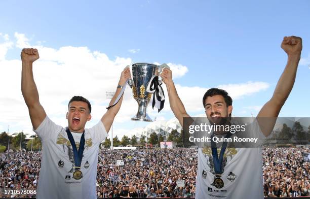 Nick Daicos and Josh Daicos of the Magpies hold up the Premiership Cup during the Collingwood Magpies AFL Grand Final celebrations fan day at AIA...