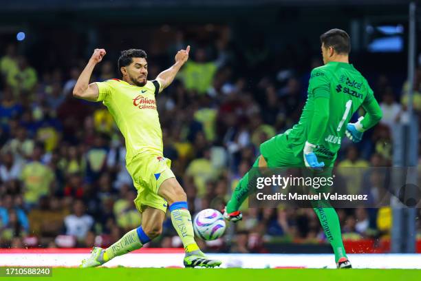 Henry Martín of America battles for the ball against Julio González of Pumas during the 10th round match between America and Pumas UNAM as part of...