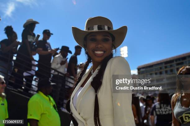 An on-field celebrity guest walks off the field after a game between the Colorado Buffaloes and the USC Trojans at Folsom Field on September 30, 2023...