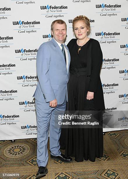 Of Columbia Records Rob Stringer and recording artist Adel attend UJA-Federation Of New York Music Visionary Of The Year Award Luncheon at The Pierre...