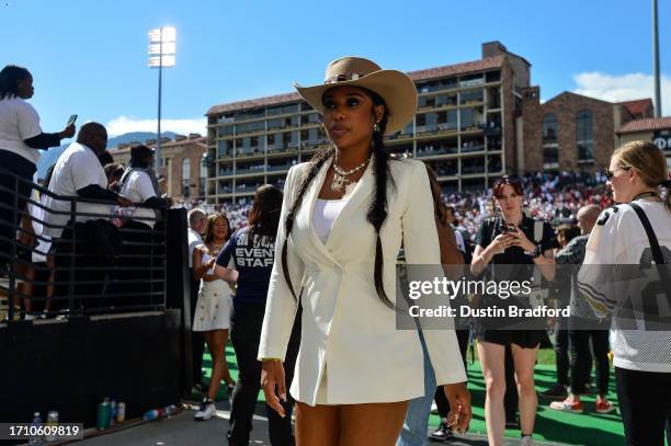 An on-field celebrity guest walks off the field after a game between the Colorado Buffaloes and the USC Trojans at Folsom Field on September 30, 2023...