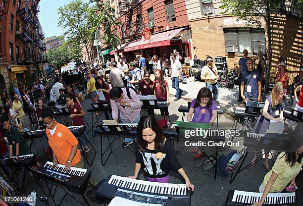 Participants take part in setting the Guiness World Record for the largest keyboard ensemble duing The National Association Of Music Merchants NAMM...