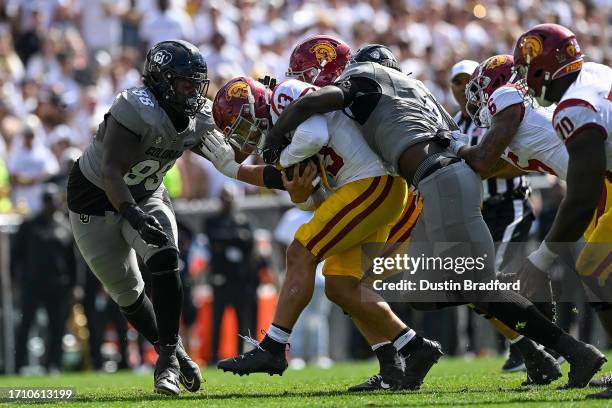 Quarterback Caleb Williams of the USC Trojans is sacked by defensive lineman Amari McNeill of the Colorado Buffaloes in the fourth quarter at Folsom...
