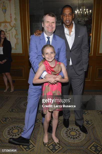 Rob Stringer and his daughter Florence pose with Jay-Z at a luncheon honoring Rob Stringer as UJA-Federation of New York Music Visionary of 2013 at...
