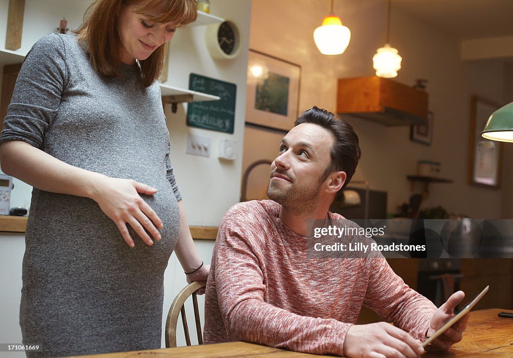 Pregnant woman and partner planning new life