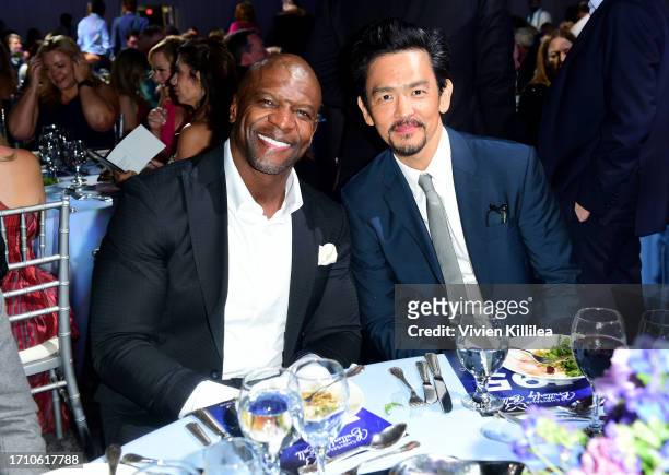 Terry Crews and John Cho attend the 2023 Chrysalis Butterfly Ball at Petersen Automotive Museum on September 30, 2023 in Los Angeles, California.