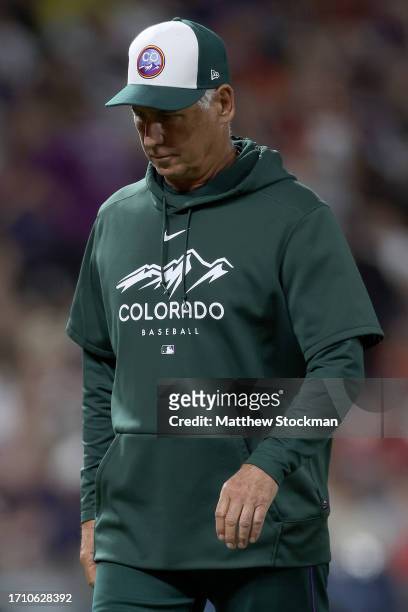 Manager Bud Black of the Colorado Rockies walks back to the dugout after changing pitchers against the Minnesota Twins in the sixth inning at Coors...