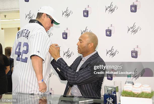 Professional Baseball Player Mariano Rivera signs EDT bottles during The Mariano Rivera Signature Limited Edition EDT At Lord & Taylor on June 21,...
