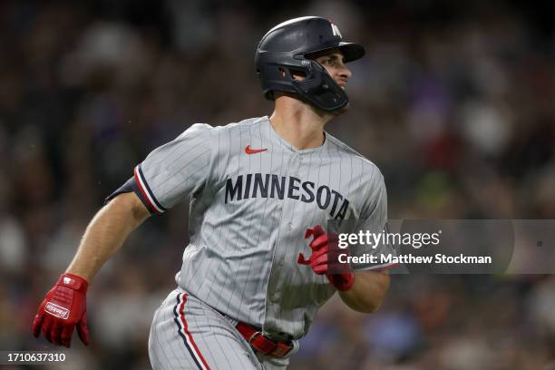 Max Wallner of the Minnesota Twins circles the bases after hitting a solo home run against the Colorado Rockies in the seventh inning at Coors Field...