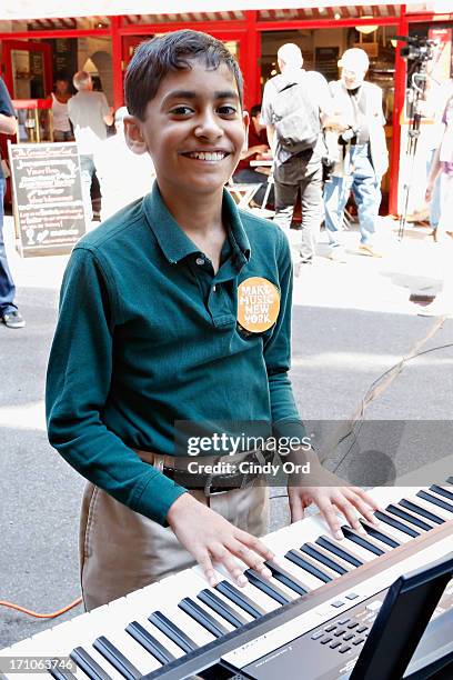 Attendees take part in setting the Guiness World Record for the largest keyboard ensemble duing The National Association Of Music Merchants NAMM...