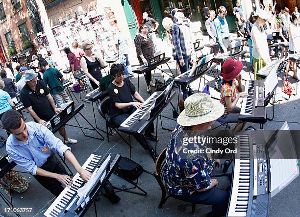 Participants take part in setting the Guiness World Record for the largest keyboard ensemble duing The National Association Of Music Merchants NAMM...