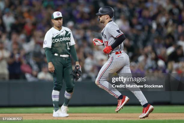 Edouard Julien of the Minnesota Twins circles the bases after hitting a two RBI home run against the Colorado Rockies in the seventh inning at Coors...