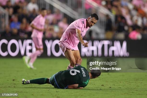 Sergio Busquets of Inter Miami CF gestures towards James Sands of New York City FC in the second half at DRV PNK Stadium on September 30, 2023 in...