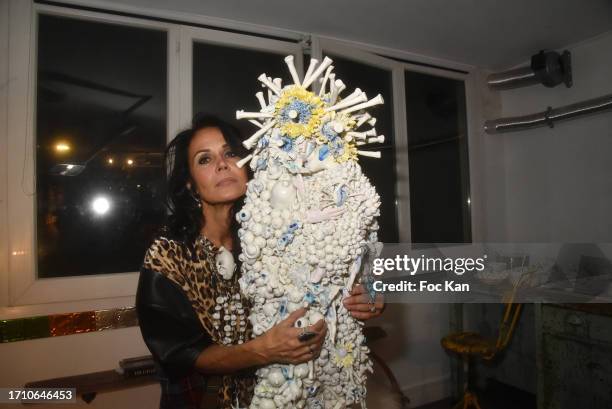 Actress/sculptor Catherine Wilkening poses with her work during during Catherine Wilkening's Open House Sculpture Exhibition Preview in on September...