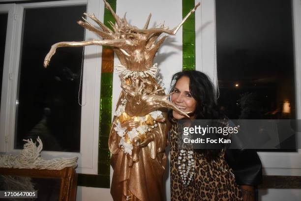 Actress/sculptor Catherine Wilkening poses with her work during during Catherine Wilkening's Open House Sculpture Exhibition Preview in on September...