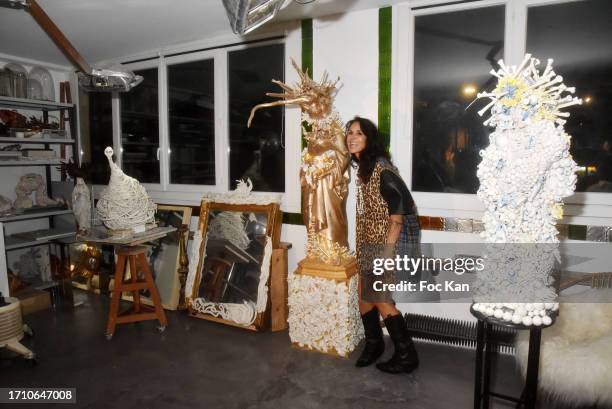 Actress/sculptor Catherine Wilkening poses with her work during during Catherine Wilkening's Open House Sculpture Exhibition Preview in on September...