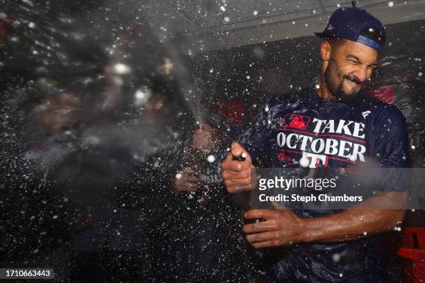 Marcus Semien of the Texas Rangers celebrates in the clubhouse after the Texas Rangers clinched a 2023 MLB playoff berth against the Seattle Mariners...