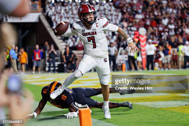 Spencer Rattler of the South Carolina Gamecocks throws a pass before stepping out of the back of the end zone in the second half during the game...