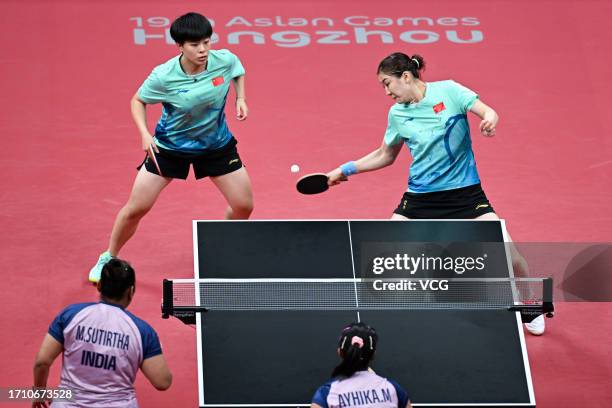 Chen Meng and Wang Yidi of China compete against Sutirtha Mukherjee and Ayhika Mukherjee of India in the Table Tennis - Women's Doubles Quarterfinal...
