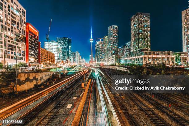 go trains in toronto going towards cn tower - toronto stock pictures, royalty-free photos & images