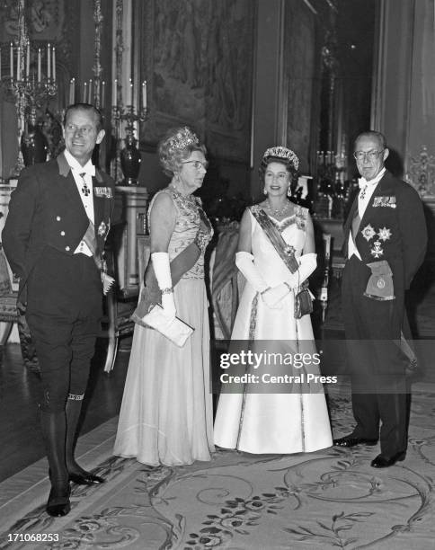Prince Philip, Queen Juliana of the Netherlands , Queen Elizabeth and Prince Bernhard of the Netherlands before a state banquet at Windsor Castle,...
