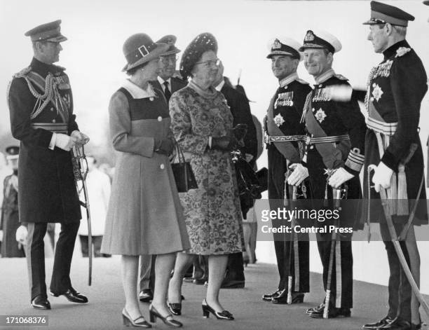 Queen Elizabeth II introduces Queen Juliana of the Netherlands to officials at the start of her state visit to Britain, Home Park, Windsor, 11th...
