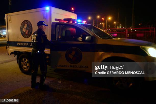 Members of the forensic police enter the Guayas 1 prison in Guayaquil, Ecuador, on October 6, 2023. Six inmates were killed Friday during a...