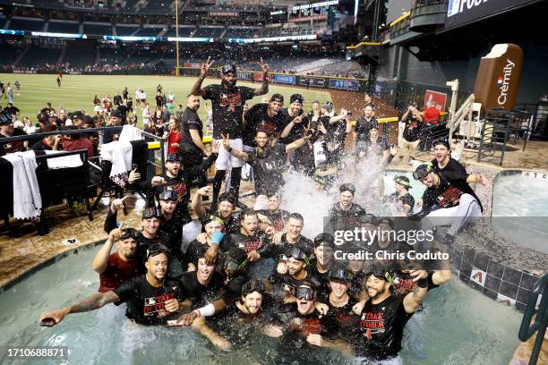 Members of the Arizona Diamondbacks pose for a photo in the Chase Field pool after the Diamondbacks clinched a National League Wild Card playoff spot...