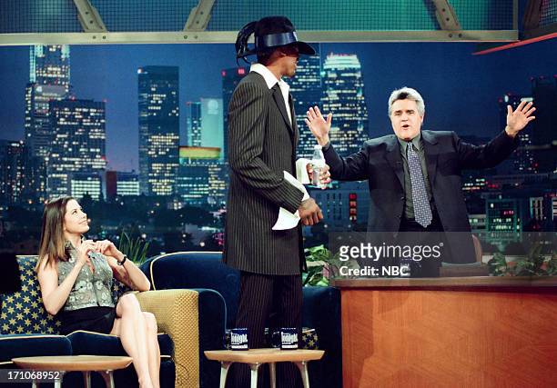Episode 1535 -- Pictured: Actress Mira Sorvino, basketball player Dennis Rodman, host Jay Leno during an interview on January 22, 1999 --