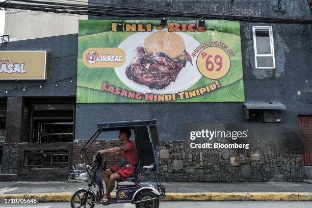 Billboard promoting unlimited rice and grilled chicken in Marikina City, Manila, the Philippines, on Friday, Oct. 6, 2023. Rice inflation in the...