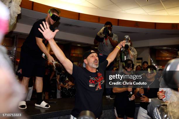 Manager Torey Lovullo of the Arizona Diamondbacks celebrates after the Diamondbacks clinched a National League Wild Card playoff spot after the game...