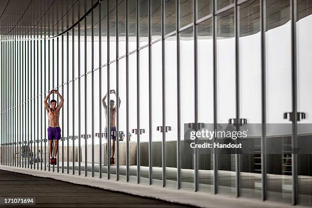 In this handout image provided by Red Bull, Matt Cowen of the United Kingdom warms up on a balcony at the Copenhagen Opera House prior to the first...