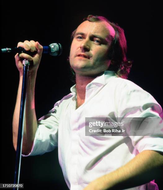 Singer and Musician Phil Collins with Genesis Band performs in concert at Inglewood Forum, October 16, 1986 in Inglewood, California.