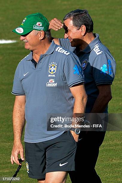 Brazil's head coach Luiz Felipe Scolari speaks with Carlos Alberto Parreira during a Brazil training session ahead of their FIFA Confederations Cup...