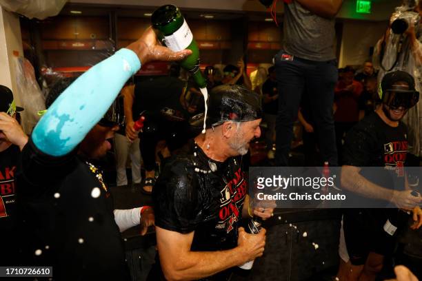 Manager Torey Lovullo of the Arizona Diamondbacks celebrates after the Diamondbacks clinched a National League Wild Card playoff spot after the game...
